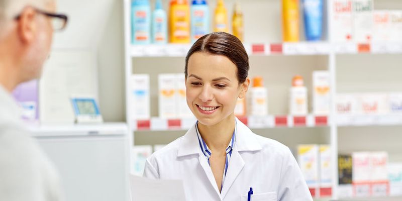 pharmacist helping patient